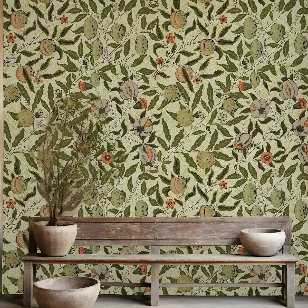 Wooden bench with a plant against a wall with decorative wallpaper featuring peaches and leaves.