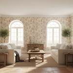 Living room with white sofas, wooden coffee table, and decorative elements.