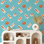 Wallpaper with beach-themed design featuring people on lounge chairs and pool floats, displayed in a room with a shelf.