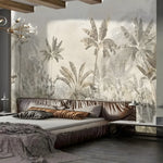 Modern bedroom with a large wall mural of tropical plants and a stylish bed.
