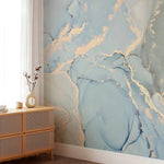 Room interior with abstract blue and gold wall mural and wooden cabinet.