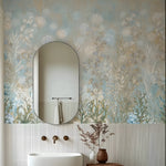 Bathroom with floral wallpaper, oval mirror, and white sink.