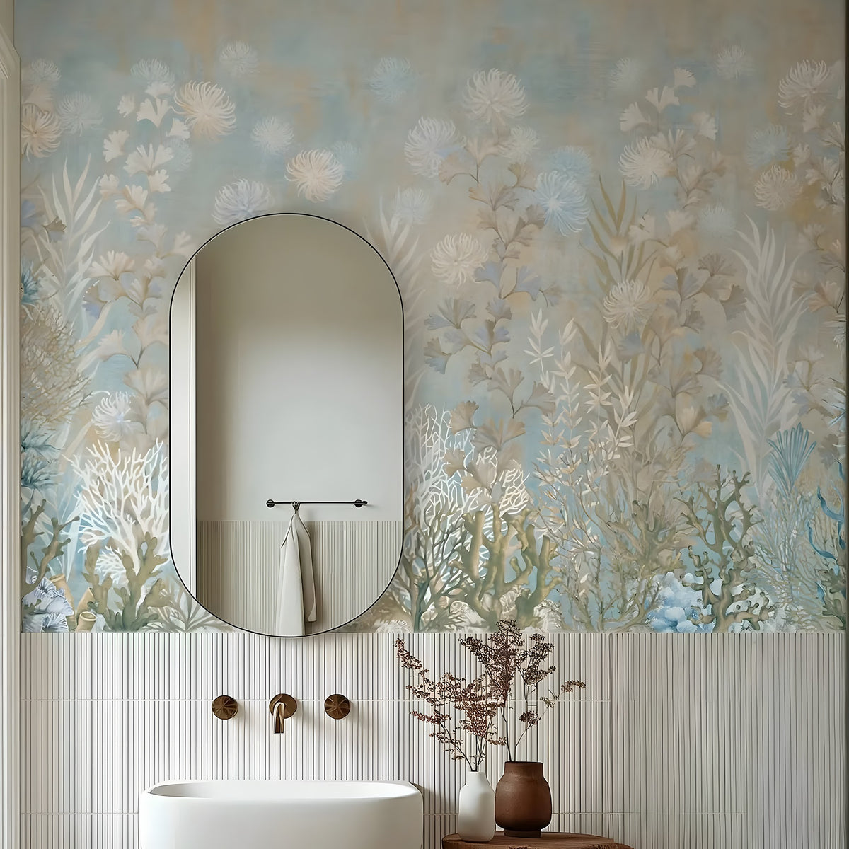 Bathroom with floral wallpaper, oval mirror, and white sink.
