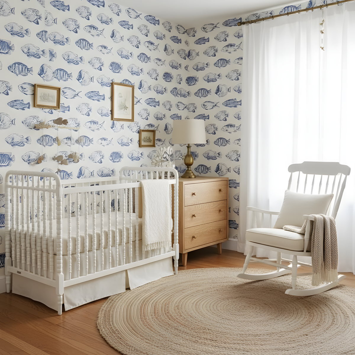 Nursery room with white crib, rocking chair, and fish-patterned wallpaper.