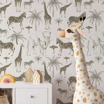 Plush giraffe toy in front of a wallpaper with animal patterns