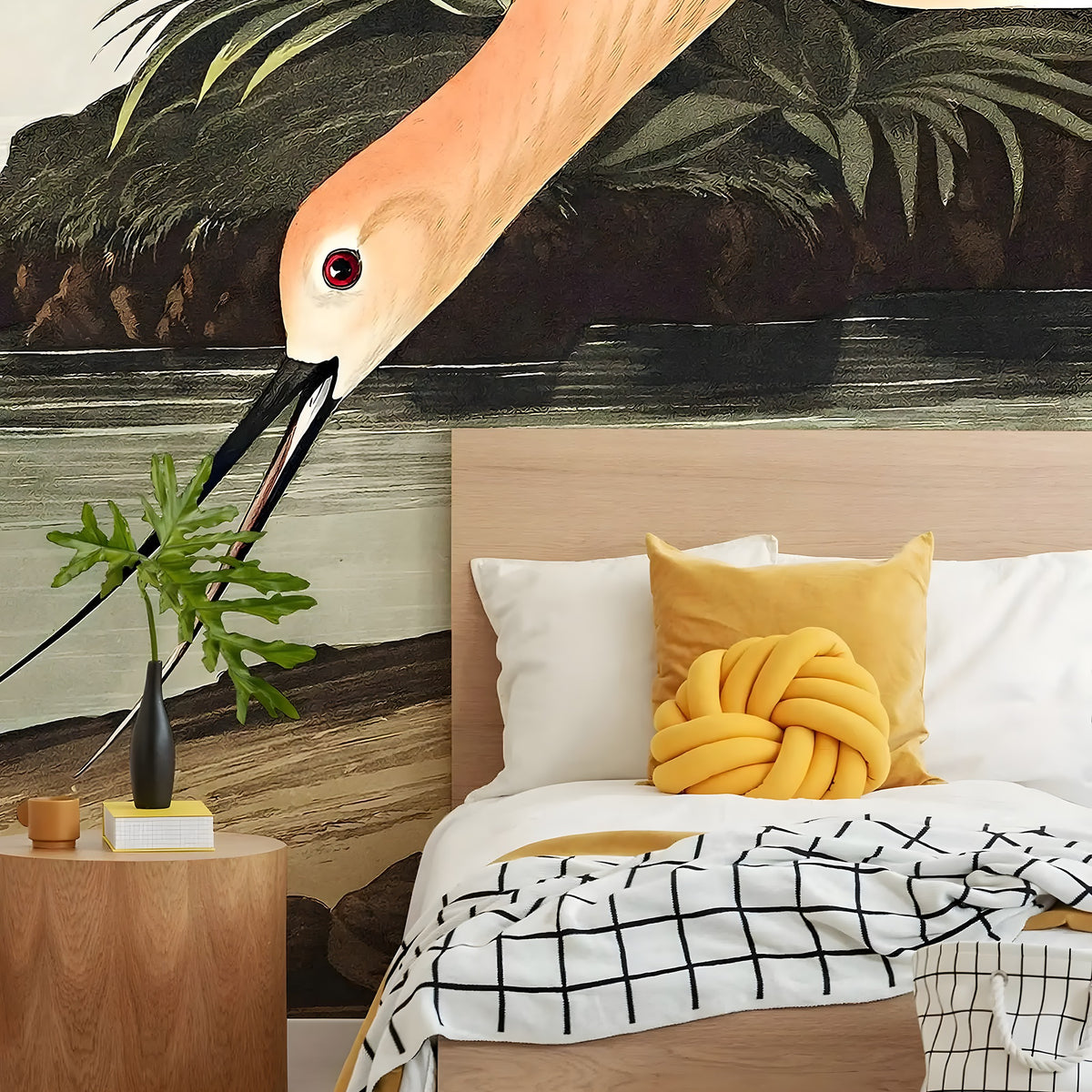 Modern bedroom with a flamingo wall mural, wooden bed, and decorative pillows.
