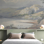 Bedroom with a large wall mural of a mountain landscape.
