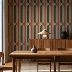 Dining room with wooden table and chairs against a patterned wall.