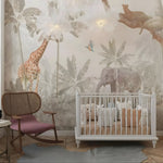 Nursery room with a crib, chair, and wall mural of animals