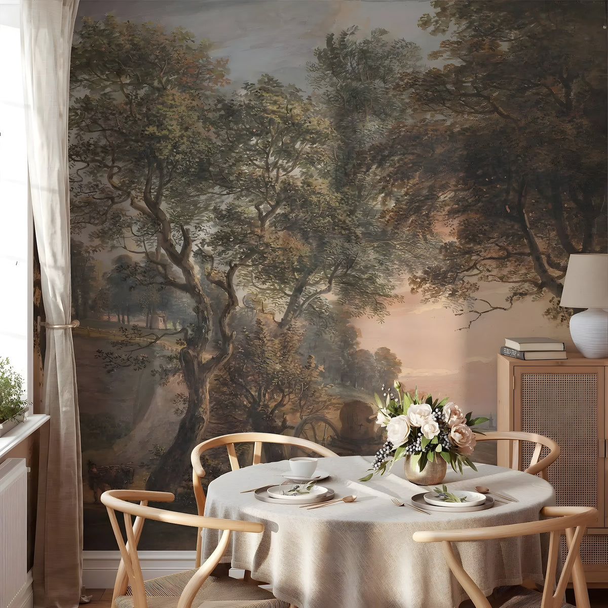 Dining room with a large wall mural of a forest scene, round table with place settings, and chairs.