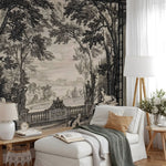 Living room with classical landscape wallpaper, white sofa, and decorative items.