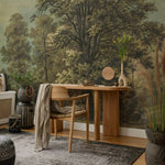 Room interior with a wooden desk, chair, and decorative elements against a forest mural.