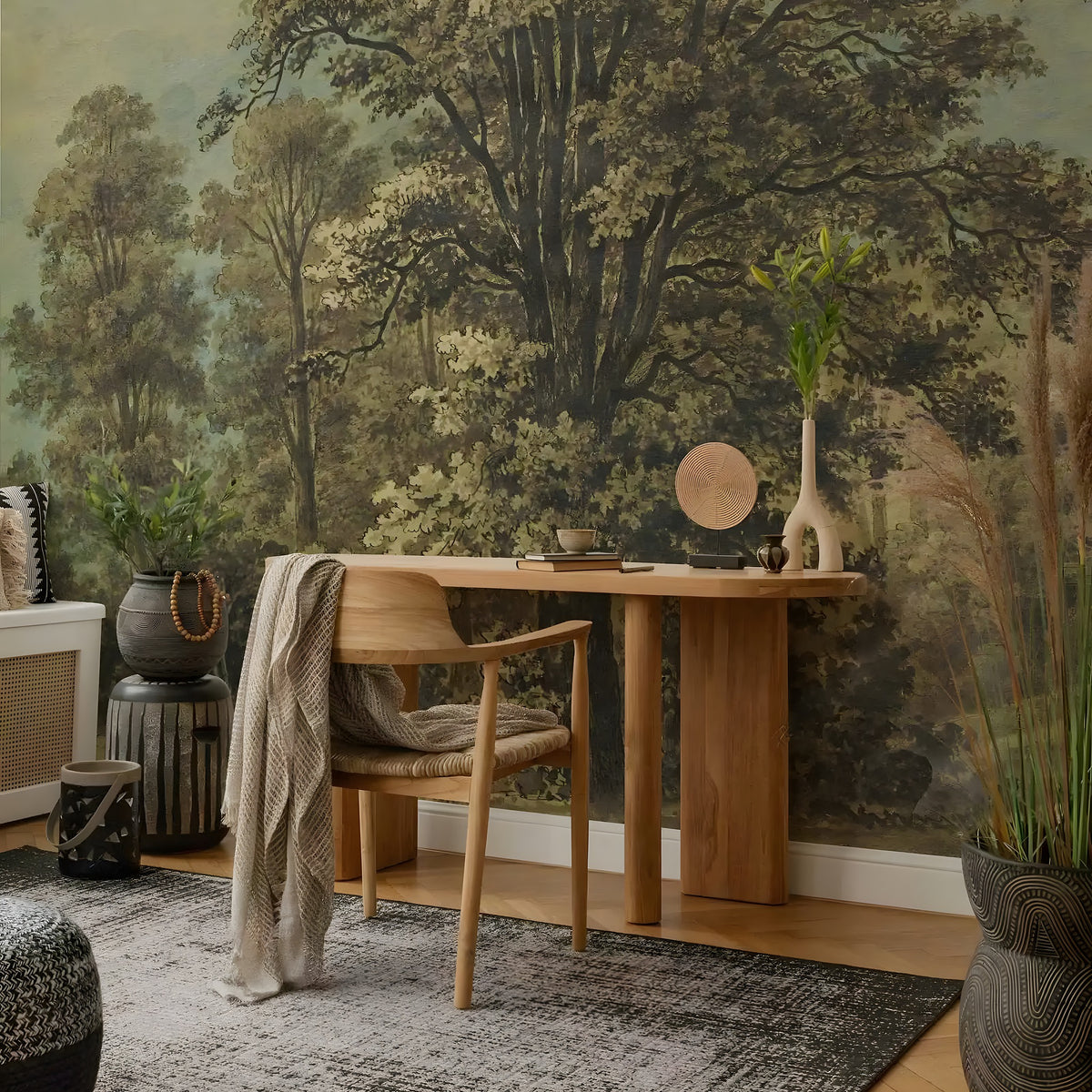 Room interior with a wooden desk, chair, and decorative elements against a forest mural.