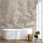 Bathroom with a freestanding bathtub against a wall with forest mural