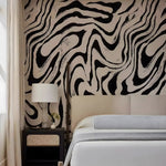 Bedroom with zebra print wall and nightstand