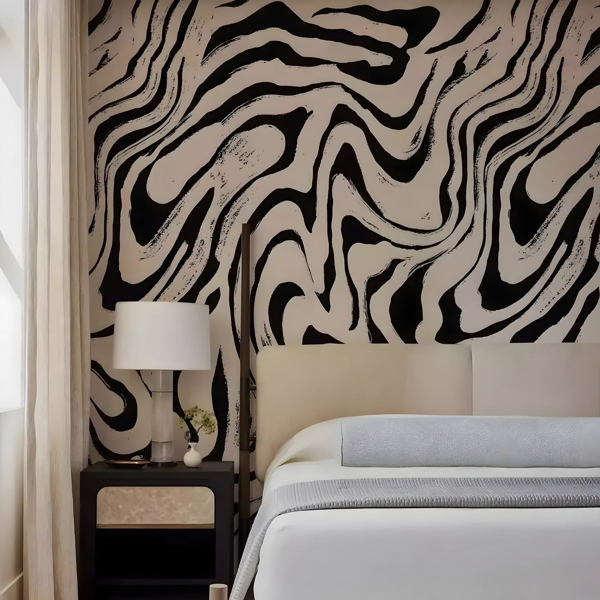Bedroom with zebra print wall and nightstand