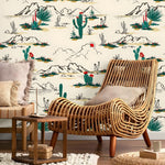 Wicker chair in a room with desert-themed wallpaper