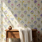 Floral wallpaper with a wooden bench and white blanket