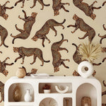 Decorative wall with cheetah pattern above a white console table with decorative items.
