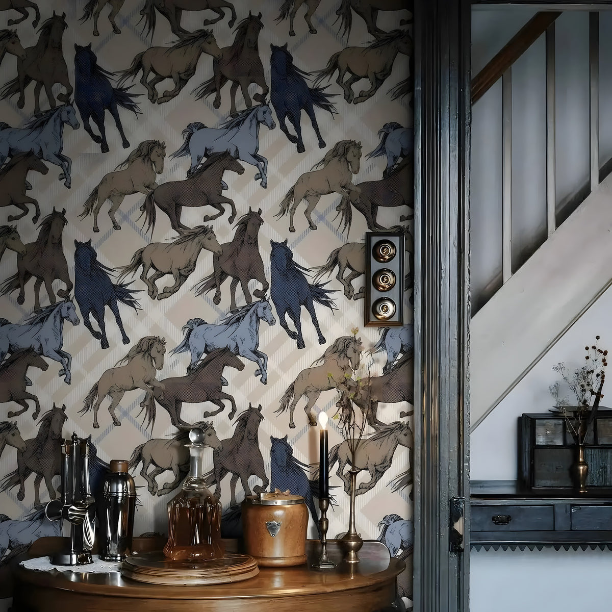 Wallpaper with horse pattern in a room with decorative items on a table.