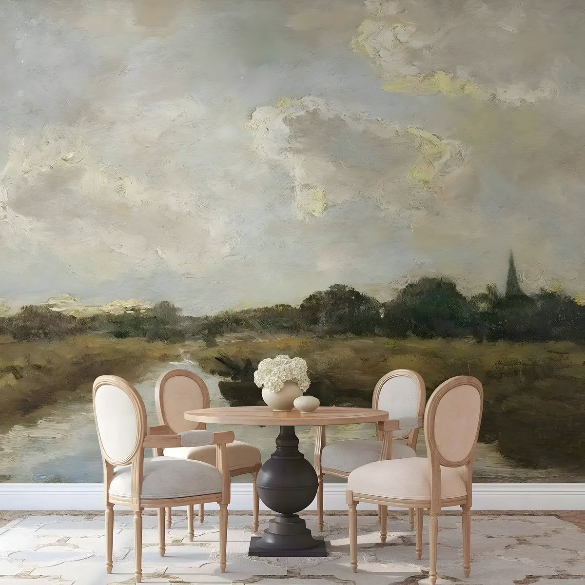 Dining area with a table and chairs against a scenic wall mural.