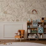 Children's room with animal-themed wallpaper, orange chair, and bookshelf with toys.