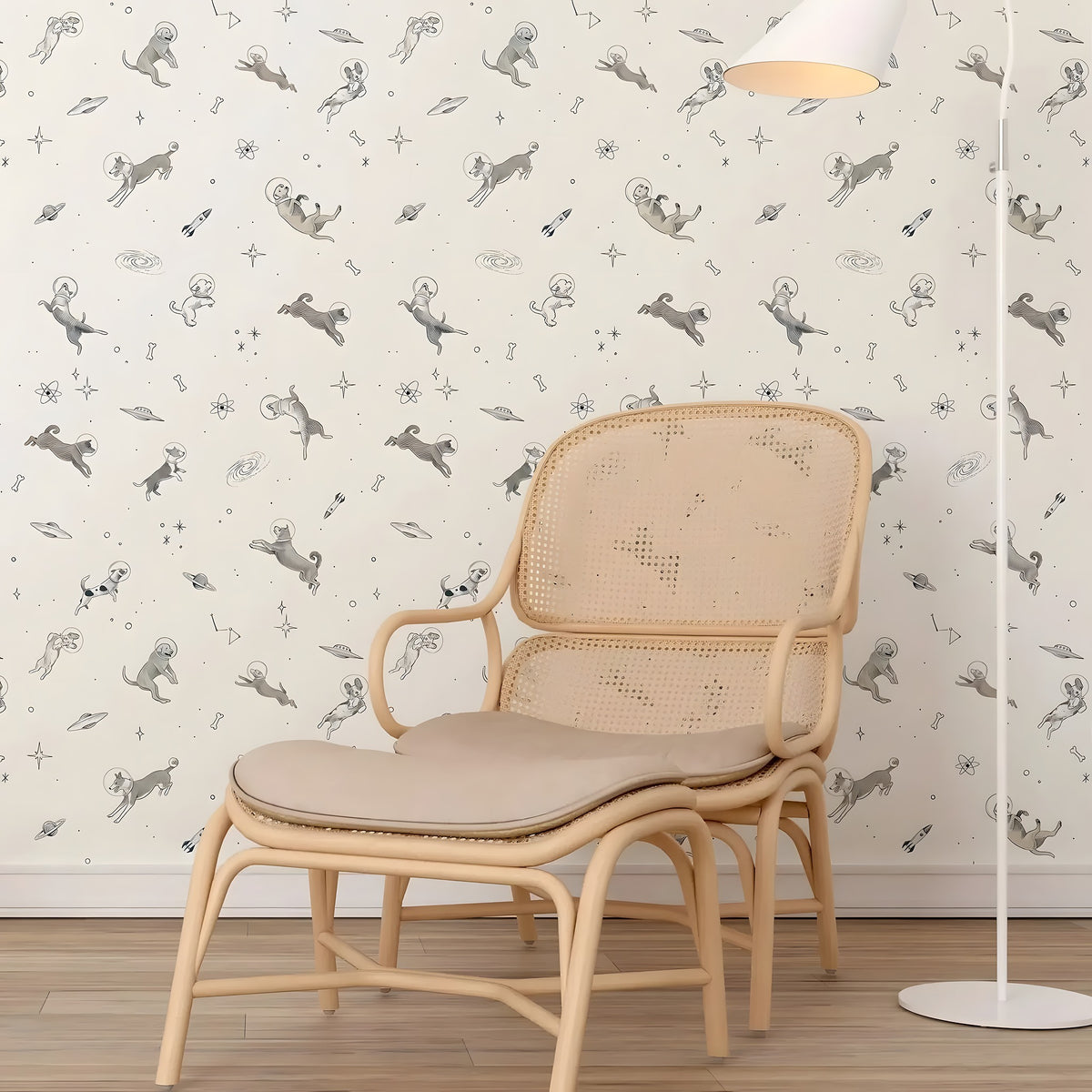 Beige wicker chair with cushion against a wall with dog-themed wallpaper