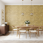 Dining room with wooden table and chairs against a patterned yellow wall.