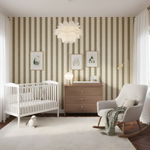 Nursery room with striped wallpaper, crib, dresser, and armchair.