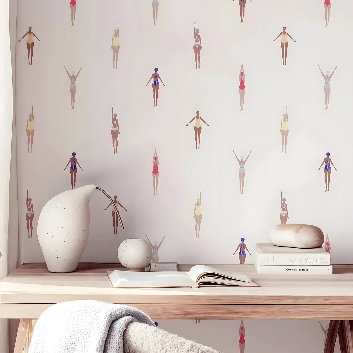 Wallpaper with small figures pattern on a wall above a wooden desk with decorative items.