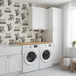 Modern laundry room with white washing machines, wooden countertop, and patterned wallpaper.