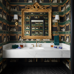 Luxurious bathroom with ornate gold mirror, marble sink, and decorative wallpaper.