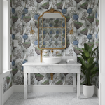 Bathroom with floral wallpaper, marble vanity, and decorative mirror.