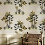 Wallpaper with palm tree design in a room with a chair.