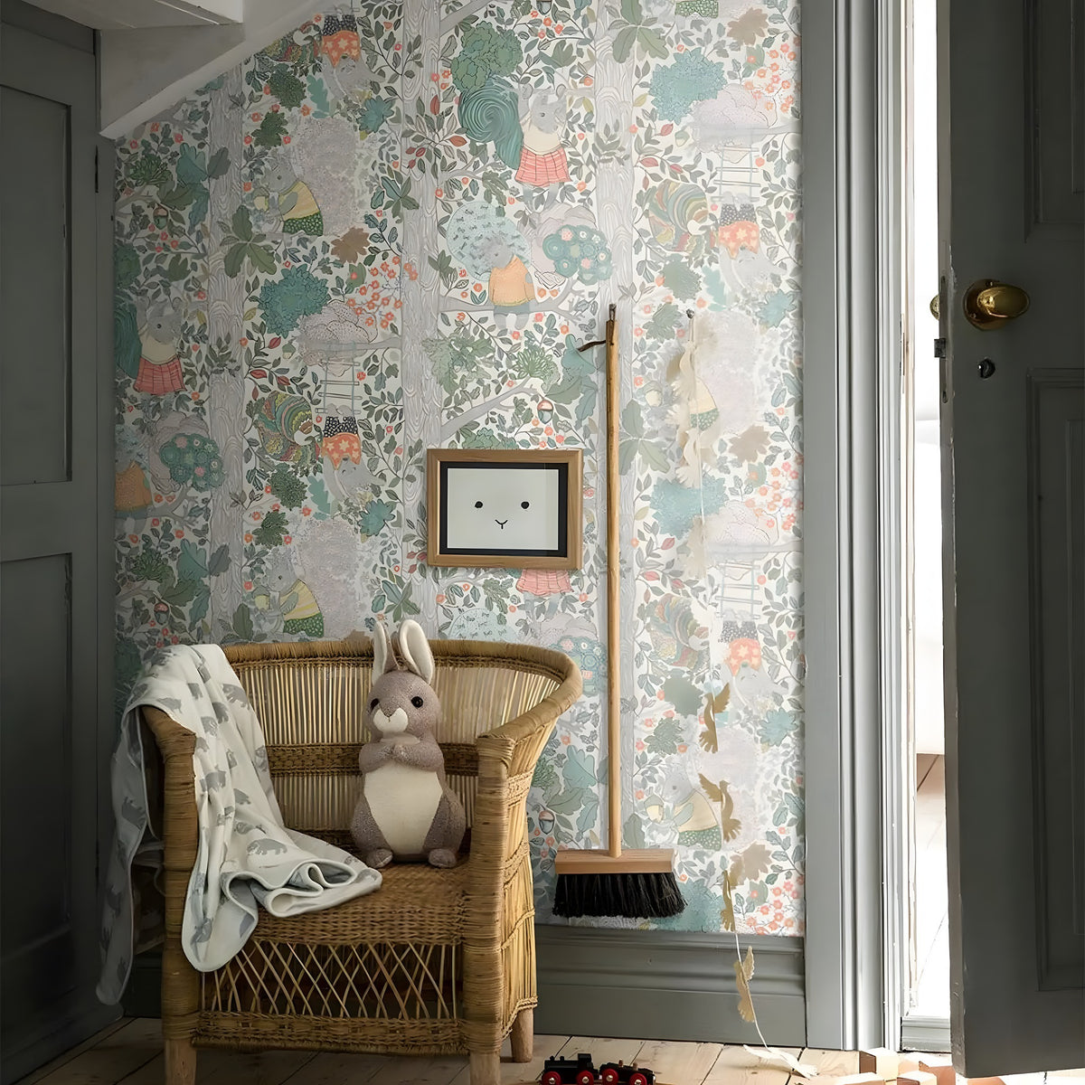 Children's room with floral wallpaper, wicker chair, and decorative elements.