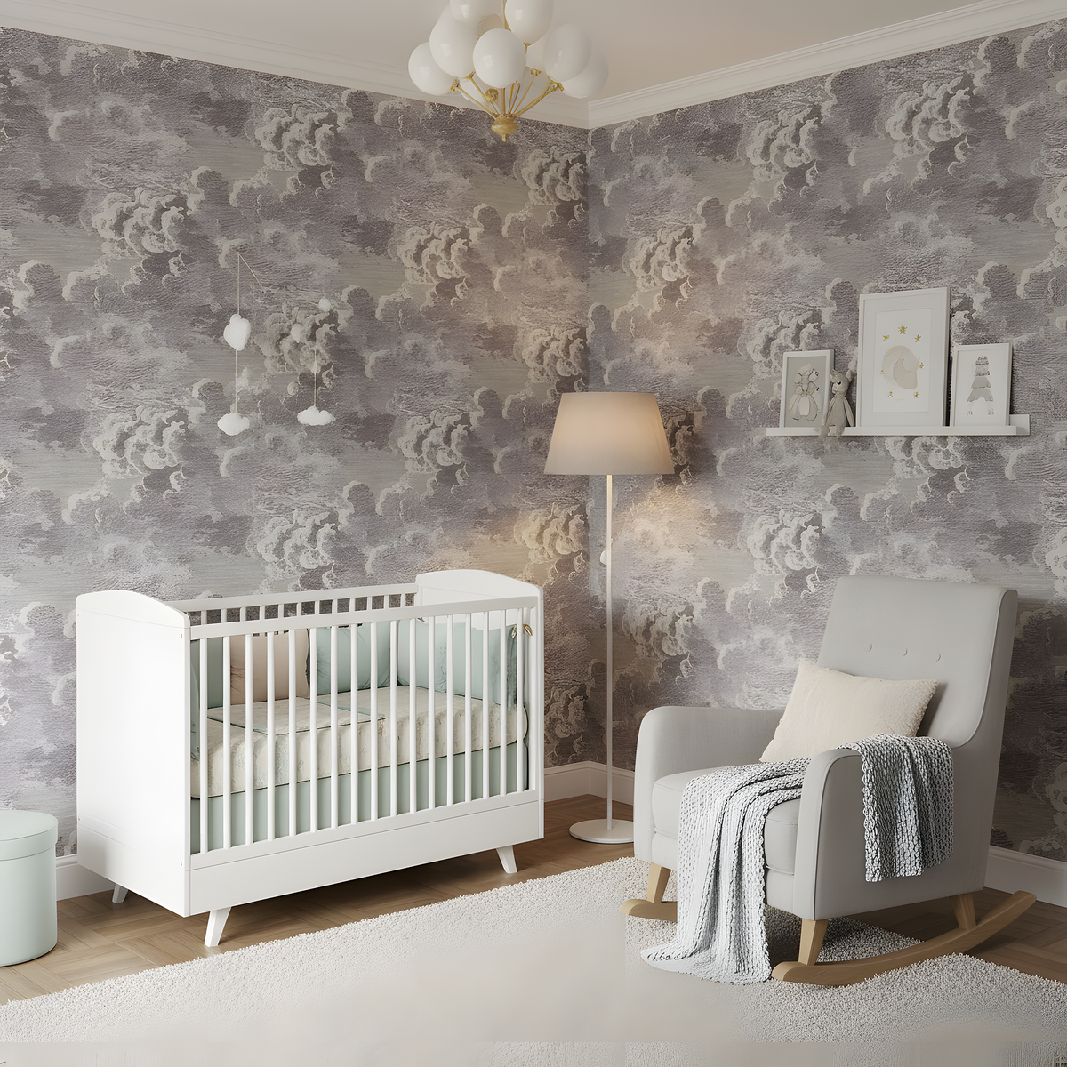 Nursery room with white crib, gray armchair, and decorative wallpaper.