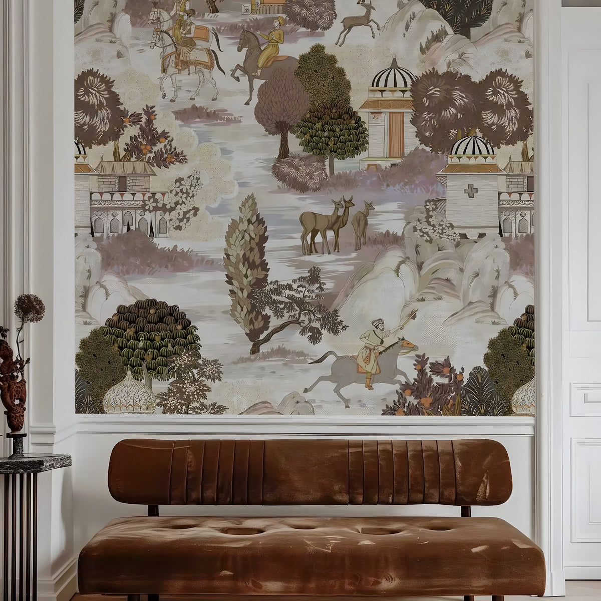 Decorative wall mural with nature and architectural elements above a brown leather bench.
