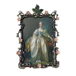 Decorative picture frame with floral design on a white background