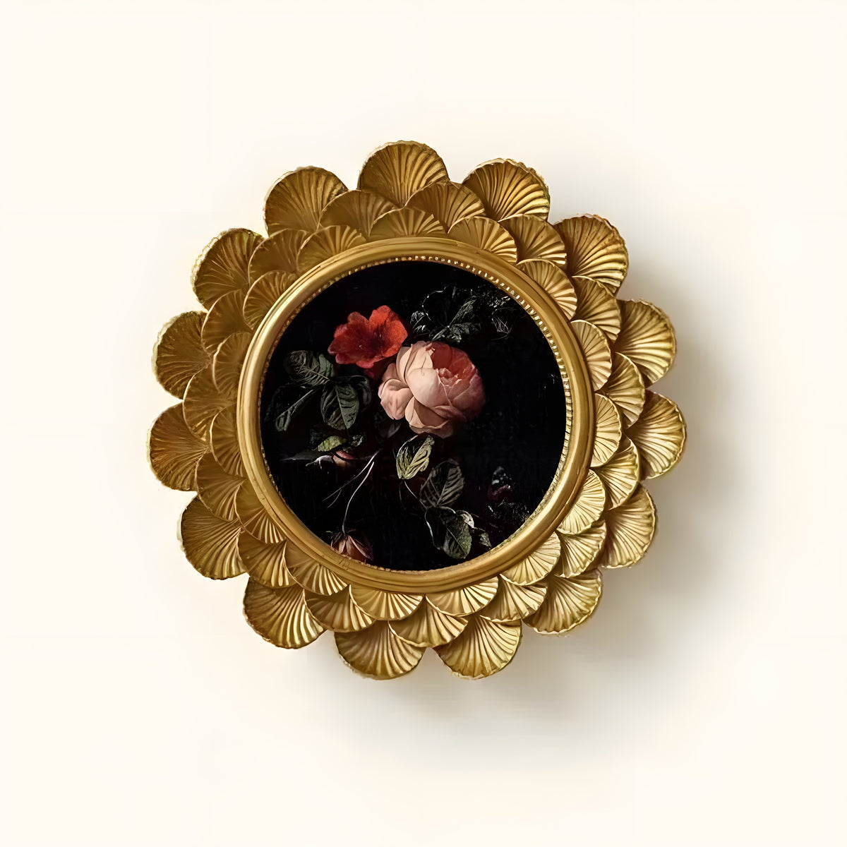 Decorative brooch with floral design and gold frame on a white background