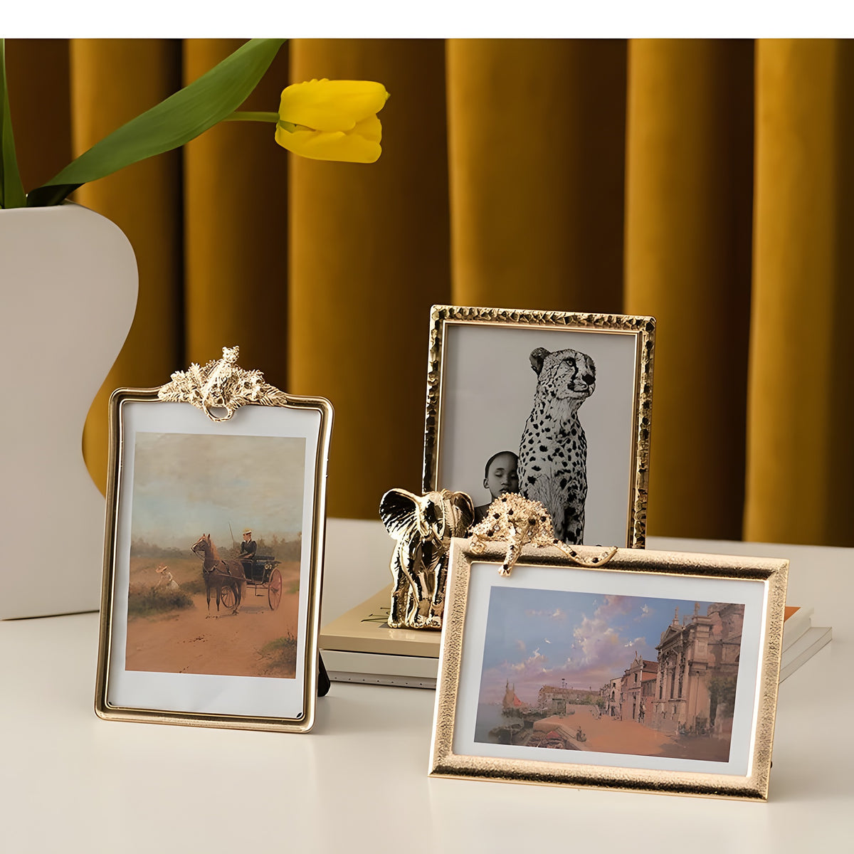 Three decorative picture frames with different designs on a surface.