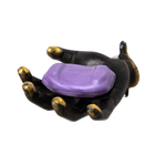 A black hand-shaped collectible figurine with gold-toned fingernails holding a purple oval-shaped item, isolated on a white background.