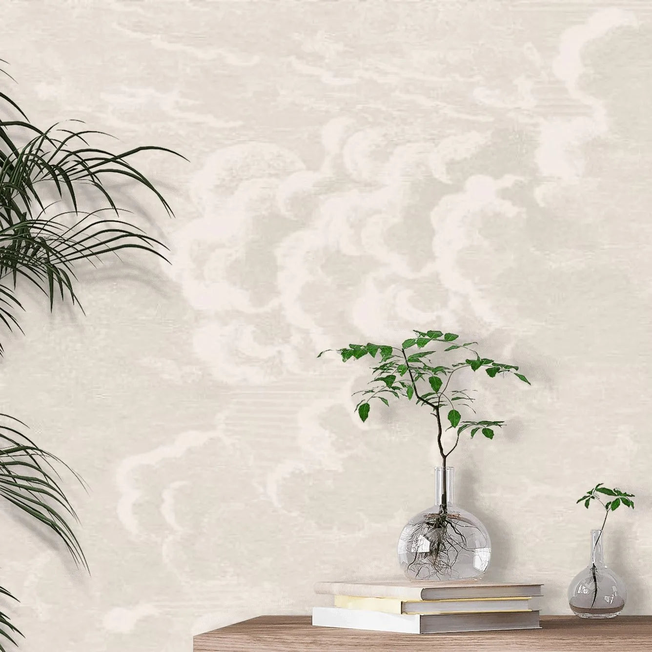 Decorative wall with textured pattern, plants, and books on a wooden surface.
