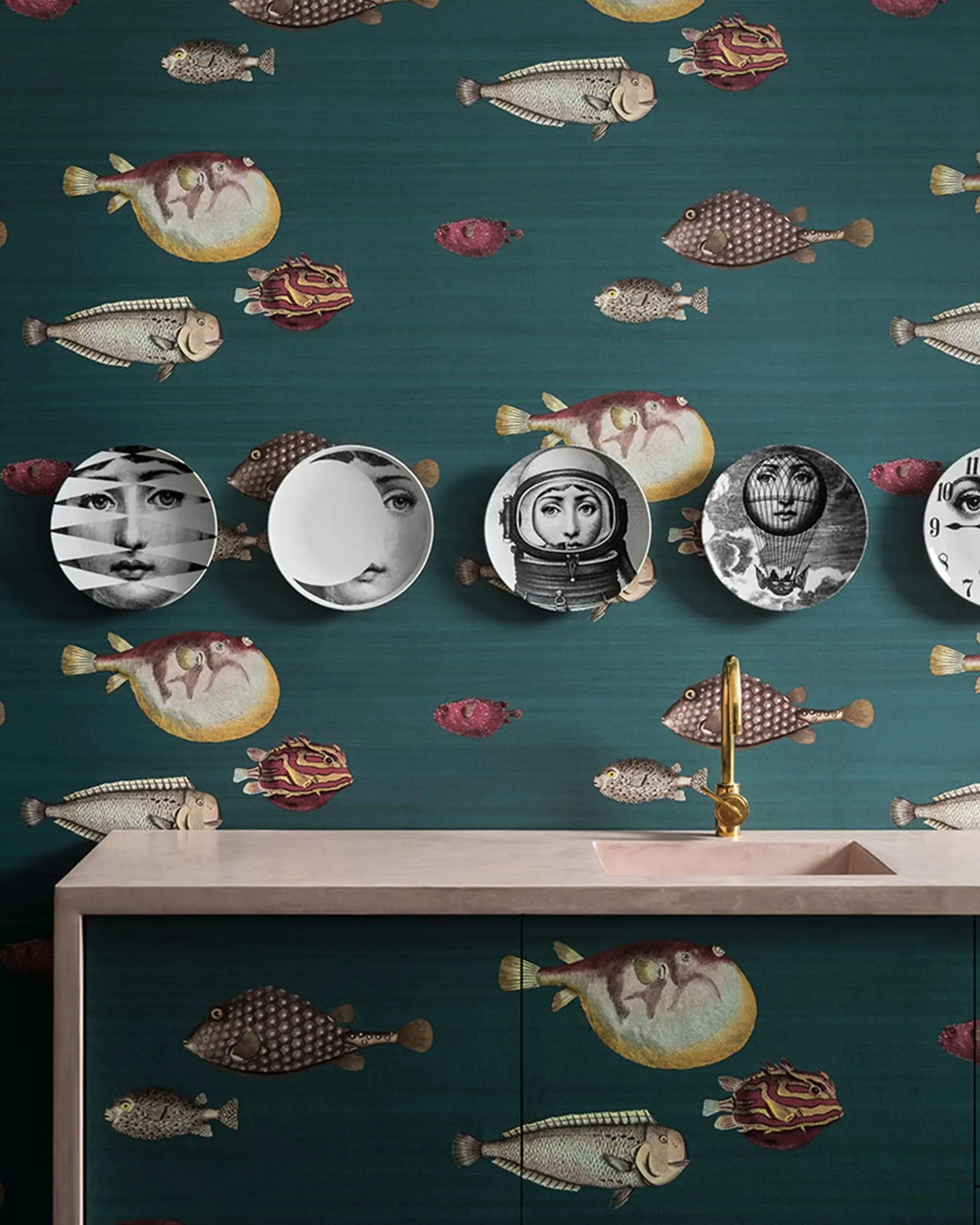 Wallpaper with fish and face patterns in a bathroom setting