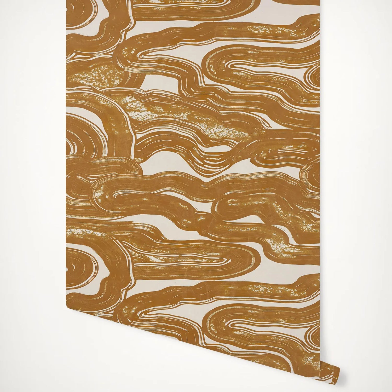 Marbleized gold and white patterned paper on a white background