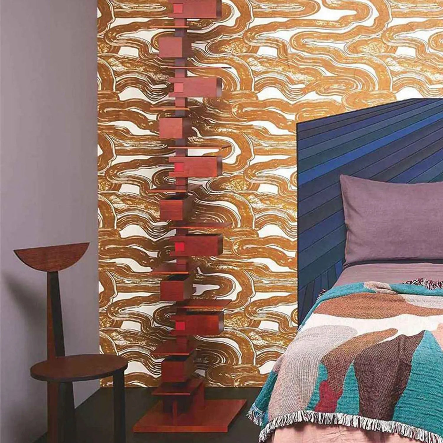Room interior with abstract wall art and colorful bedding.