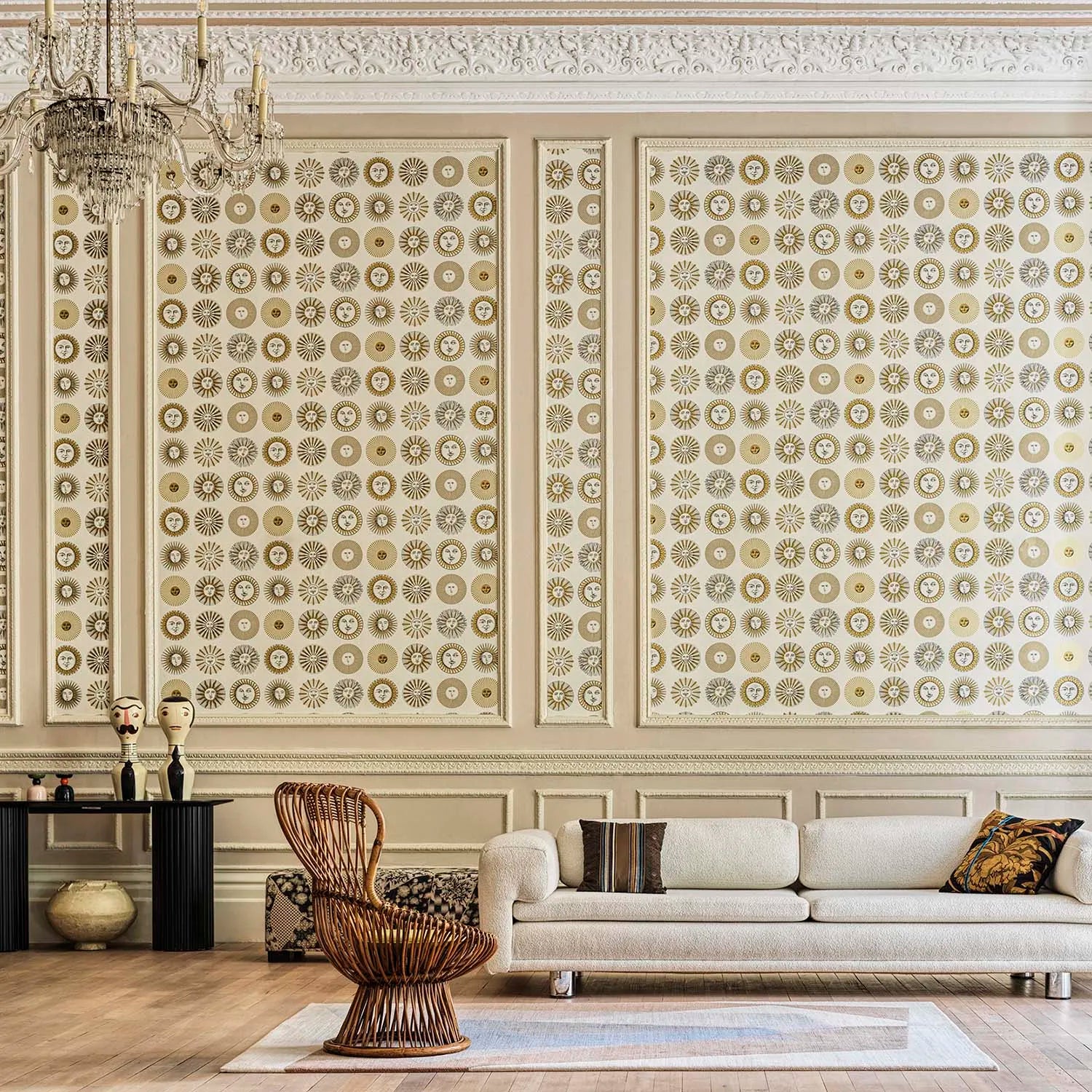 Living room with decorative wall patterns, a sofa, and a chair.