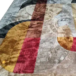 Art Deco Fusion Hand Tufted Rug featuring a bold geometric pattern in shades of red, gold, and black. This contemporary wool rug is perfect for adding a touch of elegance to your dining room or living room. Ideal as a large area rug for living room spaces, blending modern design with classic comfort.