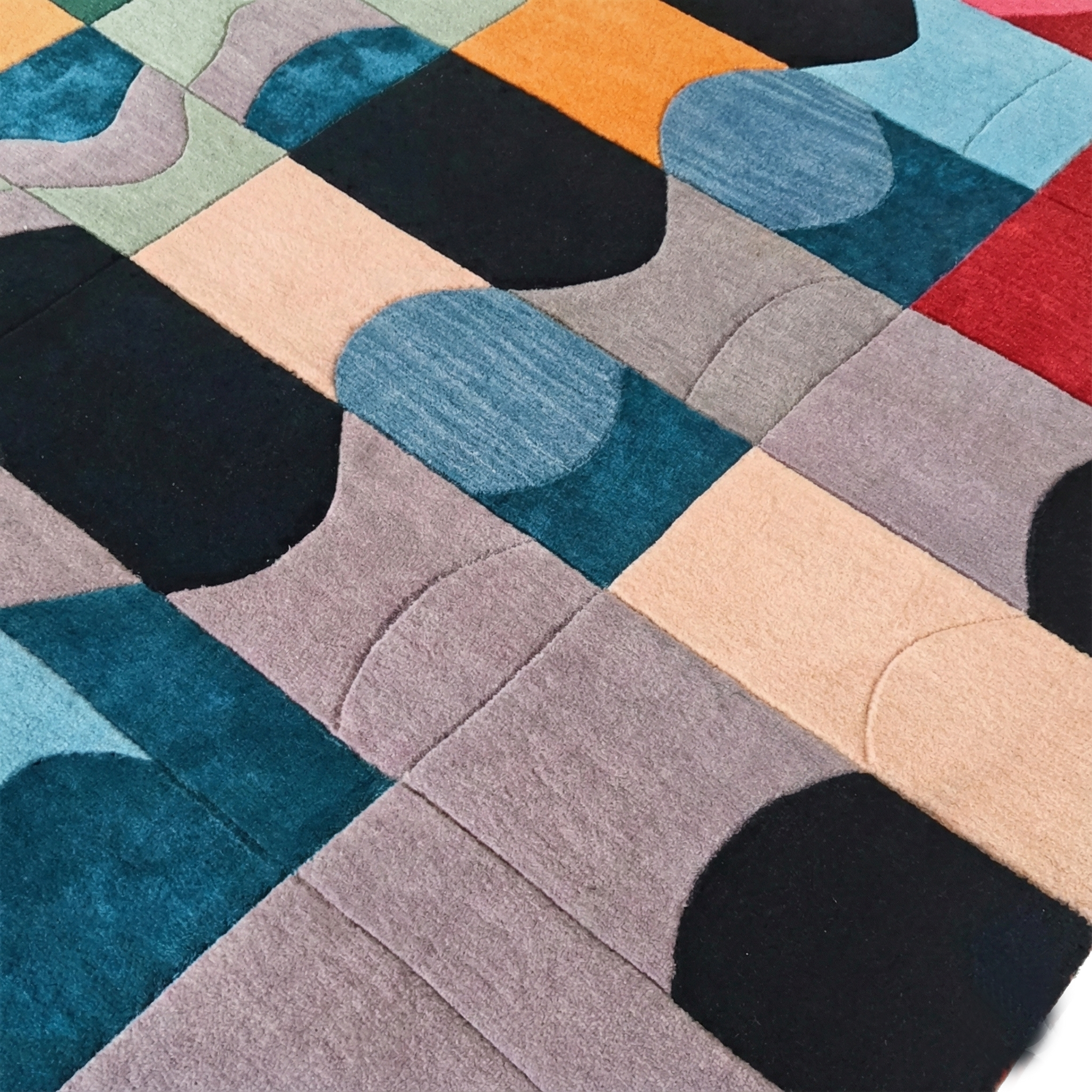 Colorful geometric-patterned rug with various shapes and colors.