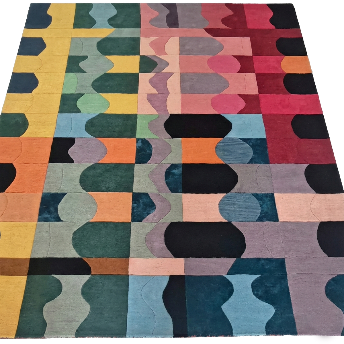 Multicolored geometric patterned rug on a white background