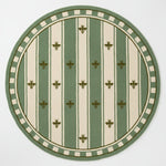 rug with green and white pattern on a light blue background